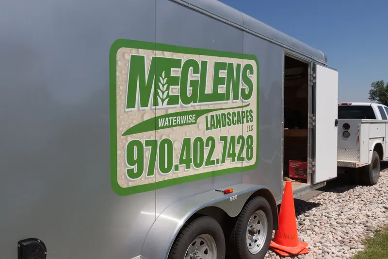 Meglen's Waterwise Landscapes equipment trailer on a job site