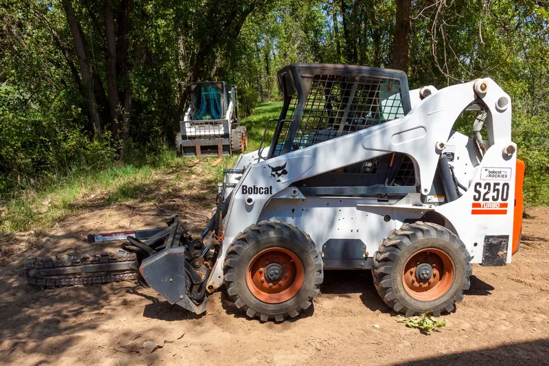 Skid steer preparing a landscape site